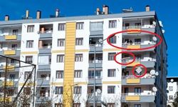 Hasarlı binaya girip, eşyalarını balkondan atarak kurtarmaya çalıştı