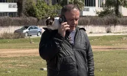 Alev alan otomobilindeki kedisini son anda kurtardı