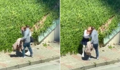 Tartıştığı kadını sokak ortasında yumruklayarak darbetti